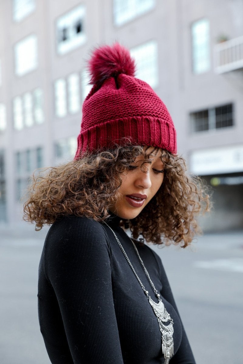 Cozy Pom Beanie with soft faux sherpa lining, perfect for winter wear.