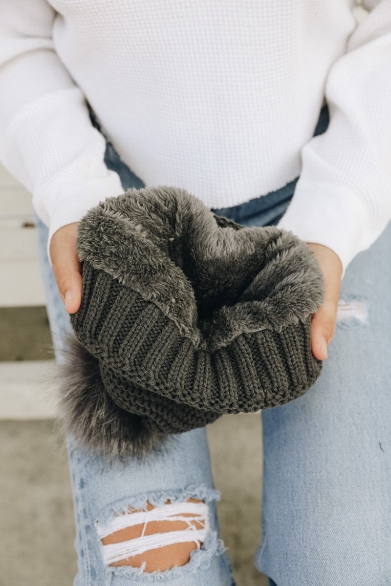 Cozy Pom Beanie with soft faux sherpa lining, perfect for winter wear.