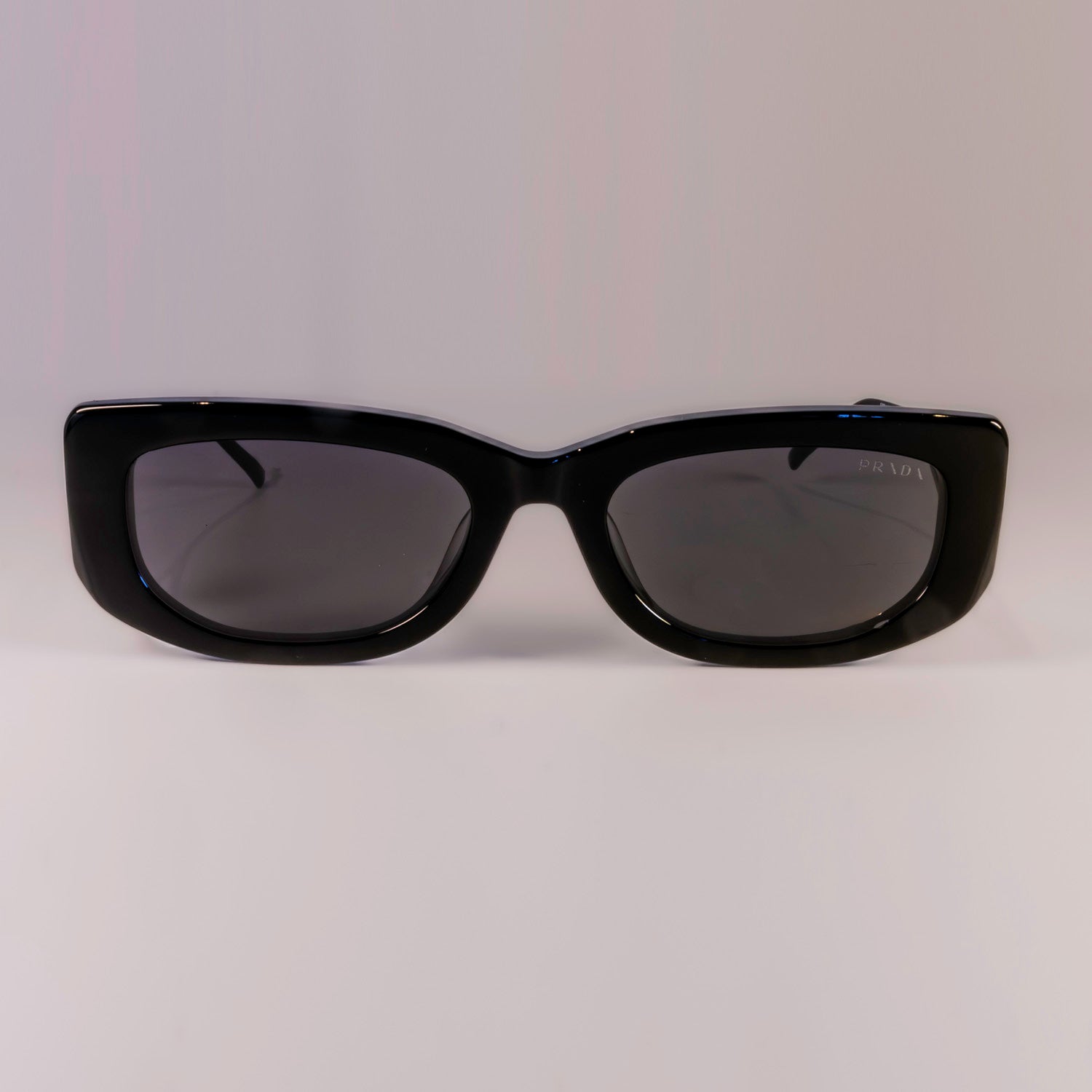 Prada PR 14YS - 1AB5S0 Sunglasses with full rim, dark grey lenses, and stylish rectangular frame.