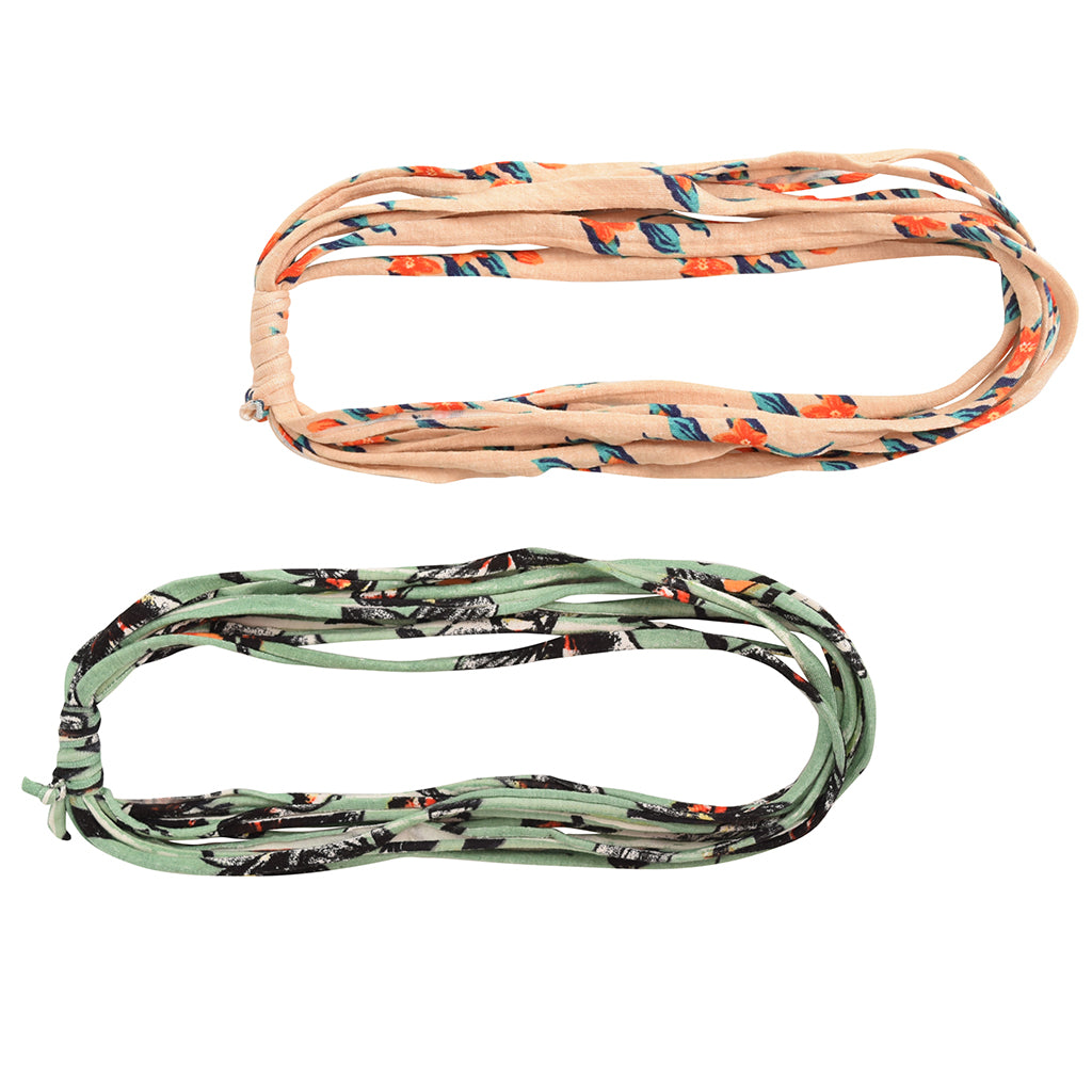 Two stylish Prints + Patterned Bela Bands in vibrant colors, showcasing their versatility as headbands and bracelets.