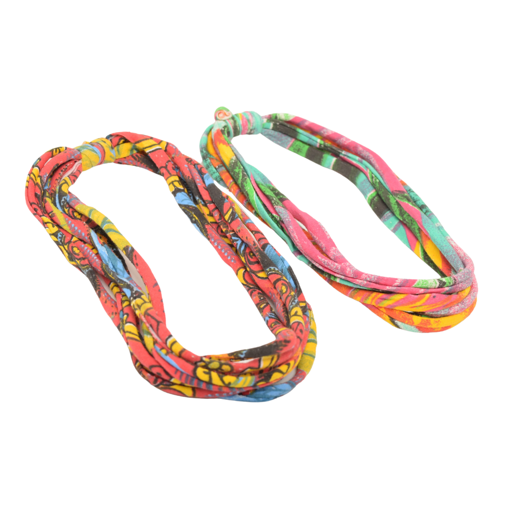 Two stylish Prints + Patterned Bela Bands in vibrant colors, showcasing their versatility as headbands and bracelets.