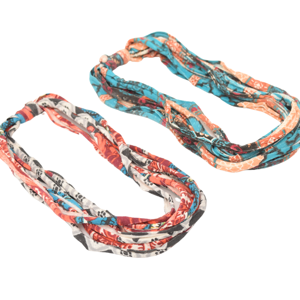 Two stylish Prints + Patterned Bela Bands in vibrant colors, showcasing their versatility as headbands and bracelets.