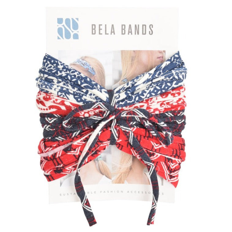 A colorful assortment of Prints + Patterns Bela Bands, showcasing their versatility as headbands and bracelets.