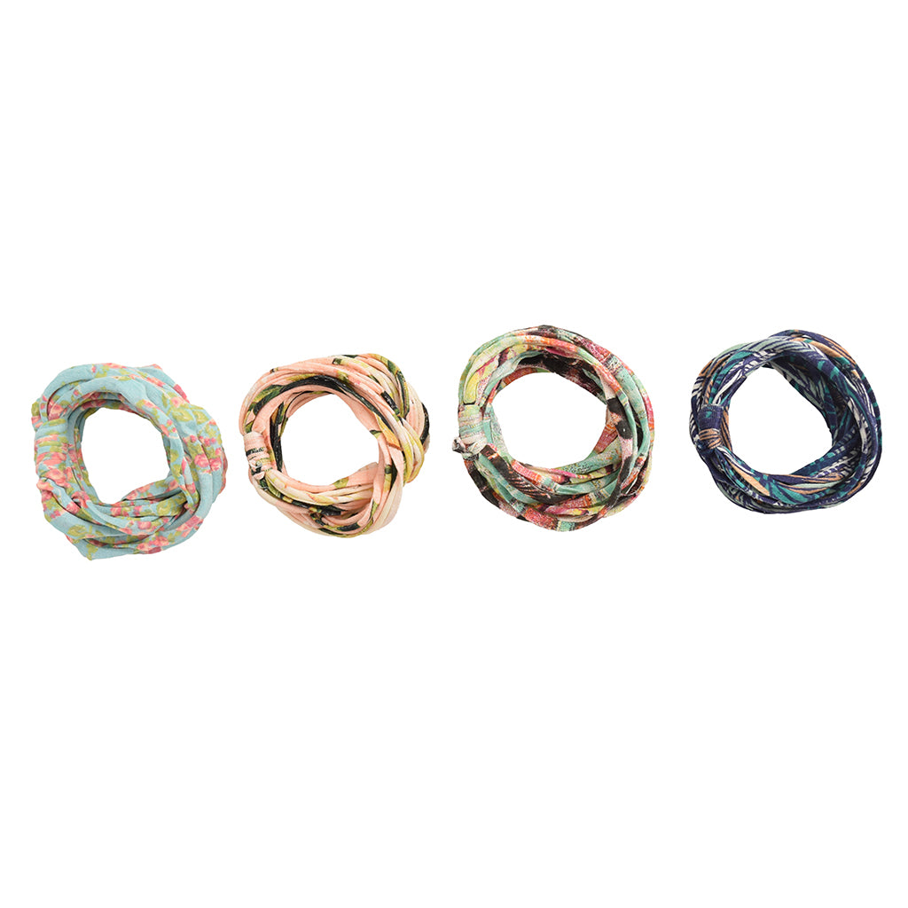 A colorful assortment of Prints + Patterns Bela Bands, showcasing their versatility as headbands and bracelets.