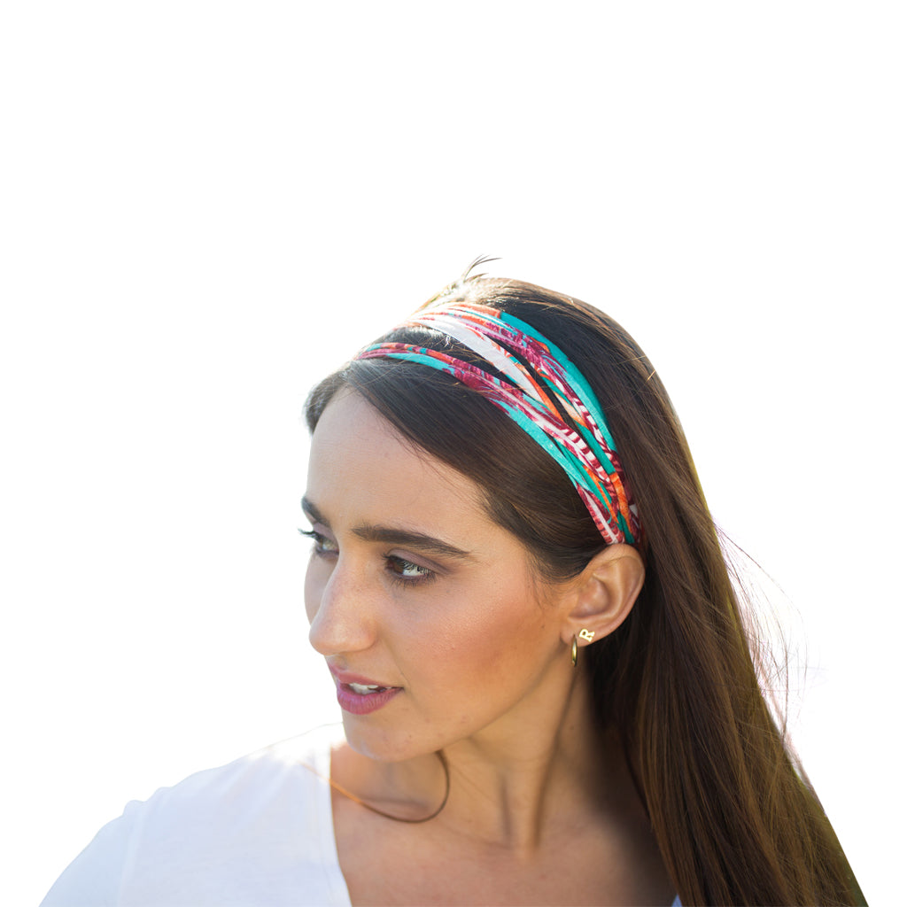 A colorful assortment of Prints + Patterns Bela Bands, showcasing their versatility as headbands and bracelets.