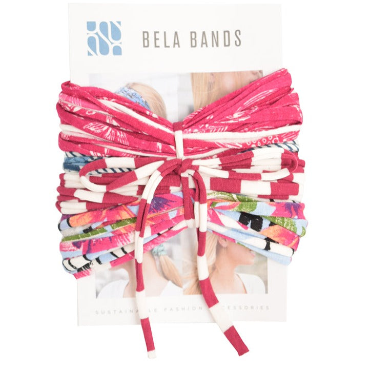 A colorful assortment of Prints + Patterns Bela Bands, showcasing their versatility as headbands and bracelets.