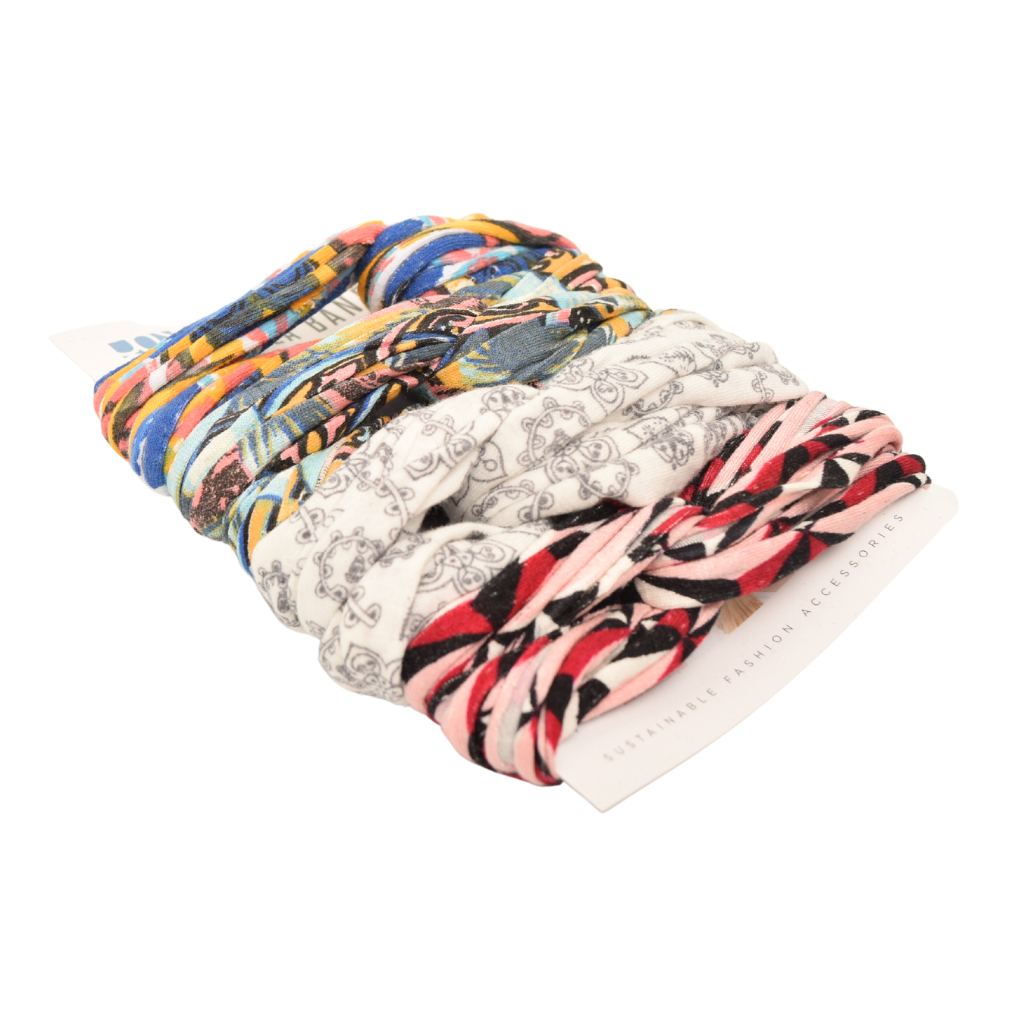 A colorful assortment of Prints + Patterns Bela Bands, showcasing their versatility as headbands and bracelets.