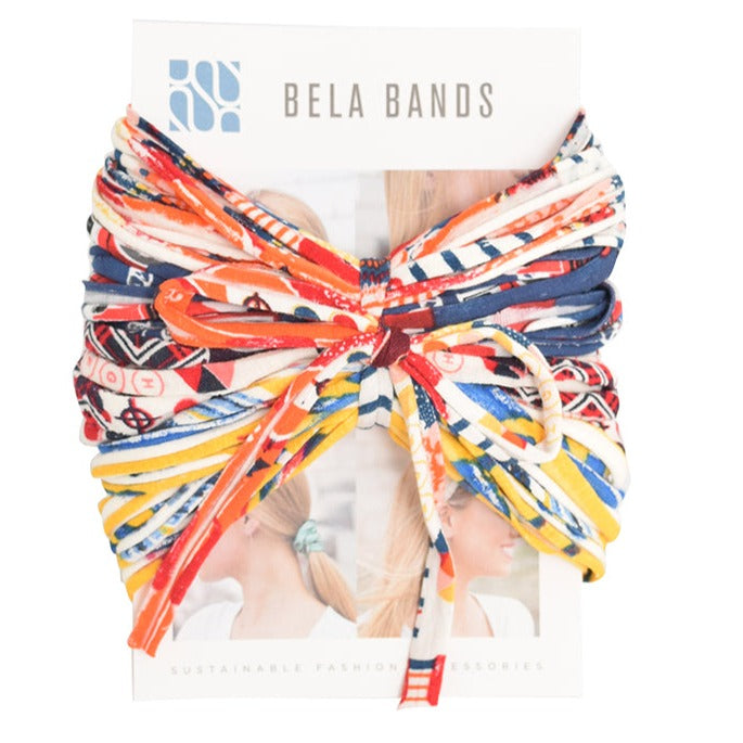 A colorful assortment of Prints + Patterns Bela Bands, showcasing their versatility as headbands and bracelets.