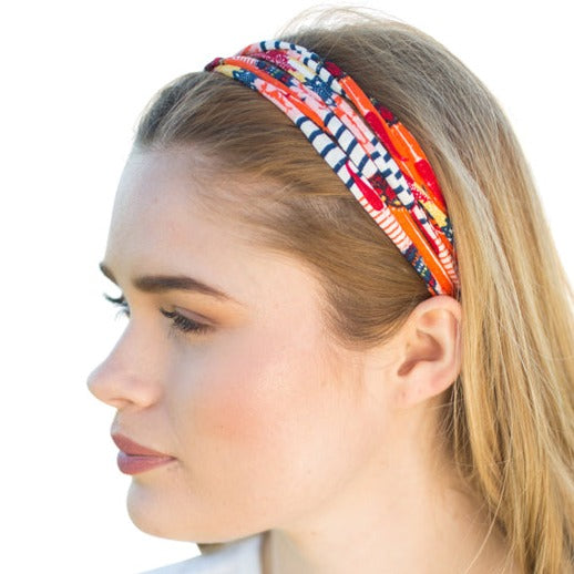 A colorful assortment of Prints + Patterns Bela Bands, showcasing their versatility as headbands and bracelets.