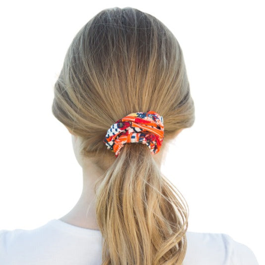 A colorful assortment of Prints + Patterns Bela Bands, showcasing their versatility as headbands and bracelets.