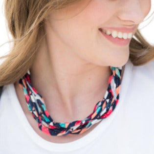 A colorful assortment of Prints + Patterns Bela Bands, showcasing their versatility as headbands and bracelets.