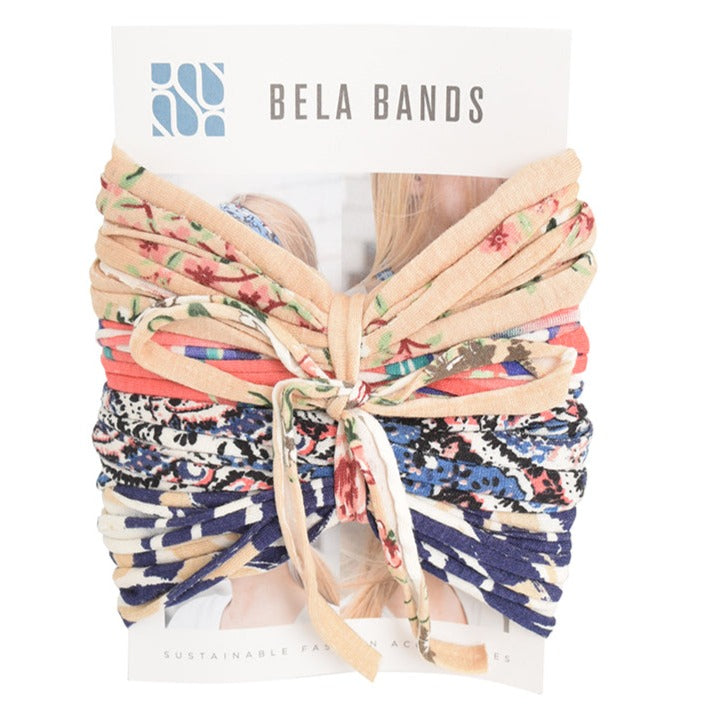 A colorful assortment of Prints + Patterns Bela Bands, showcasing their versatility as headbands and bracelets.