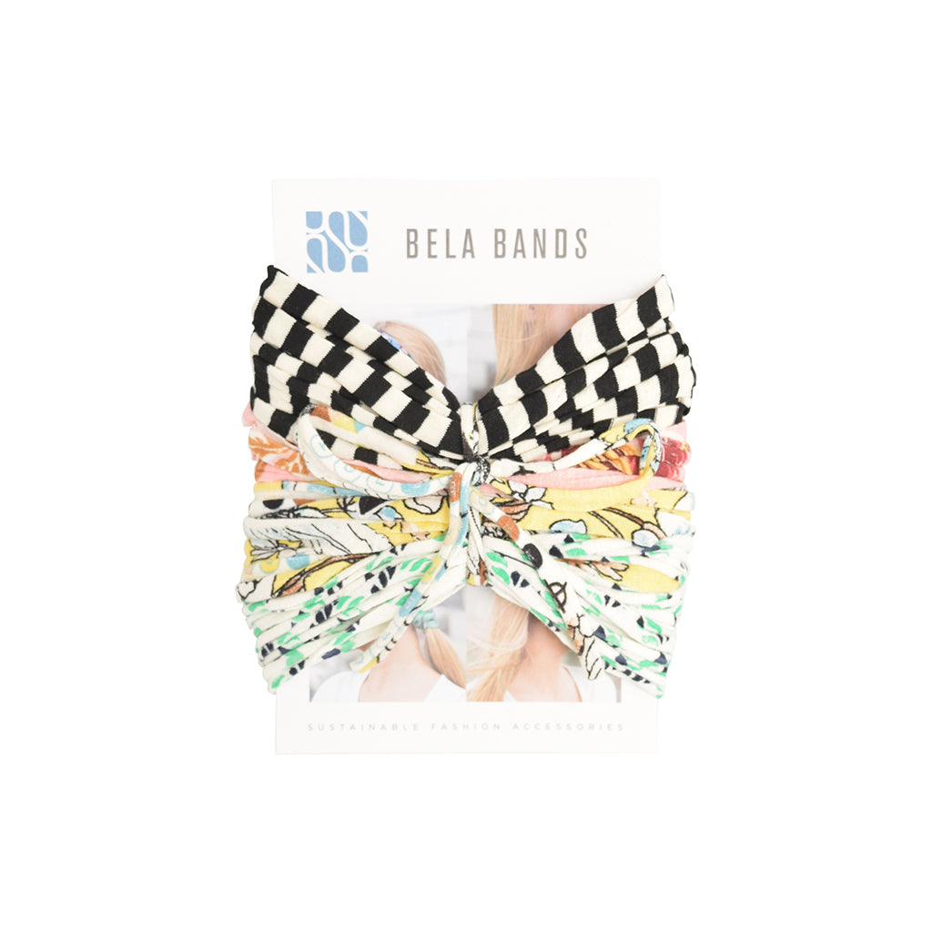 A colorful assortment of Prints + Patterns Bela Bands, showcasing their versatility as headbands and bracelets.