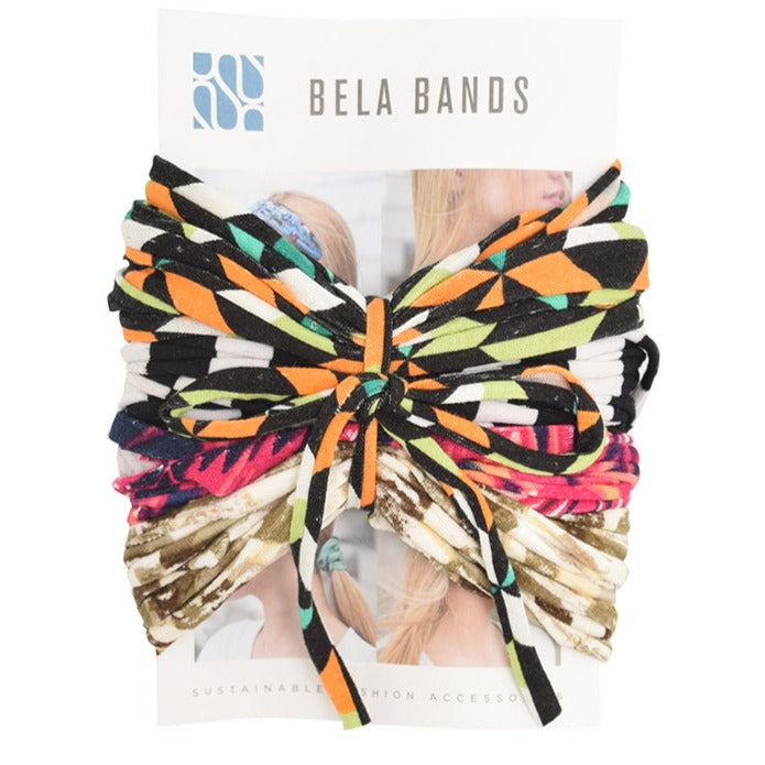 A colorful assortment of Prints + Patterns Bela Bands, showcasing their versatility as headbands and bracelets.