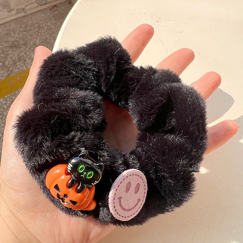 Pumpkin color cute ghost hair tie featuring a vibrant ghost design, perfect for Halloween celebrations.