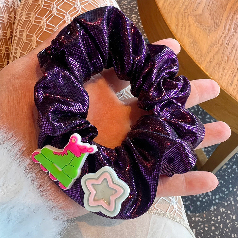 Purple shiny hair tie with Barbie stickers, stylish accessory for women.