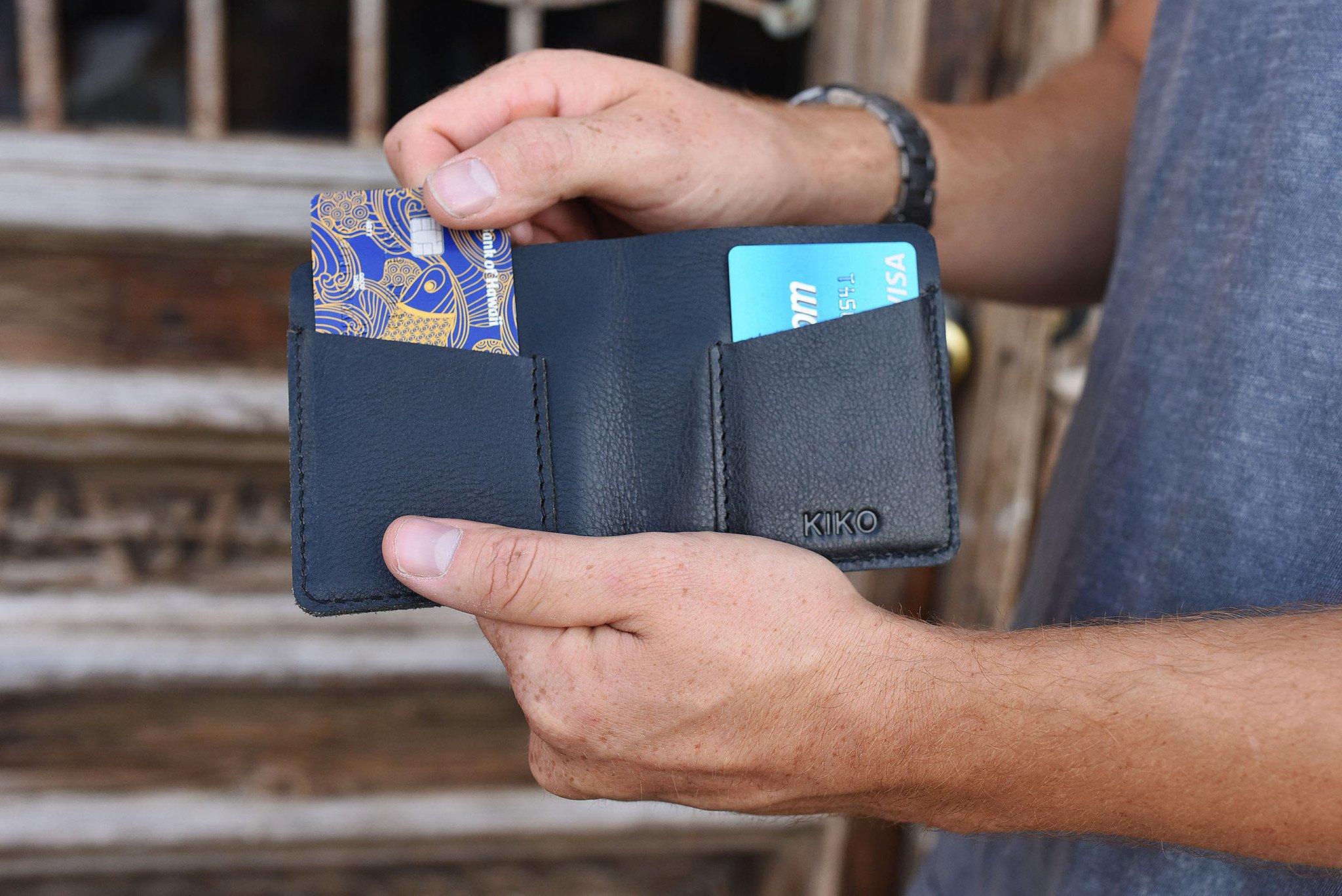 A sleek black leather Ram Wallet with two card slots and a bill compartment, showcasing its minimalistic design.