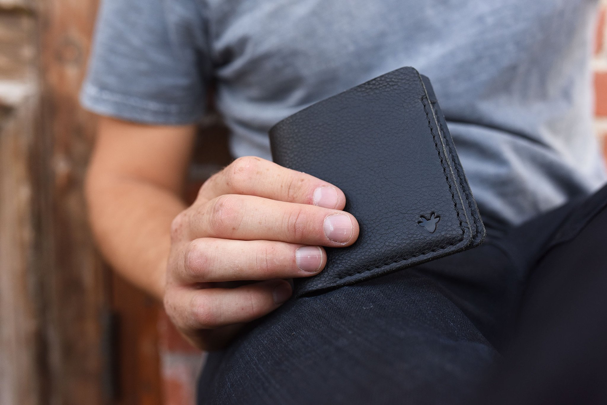 A sleek black leather Ram Wallet with two card slots and a bill compartment, showcasing its minimalistic design.