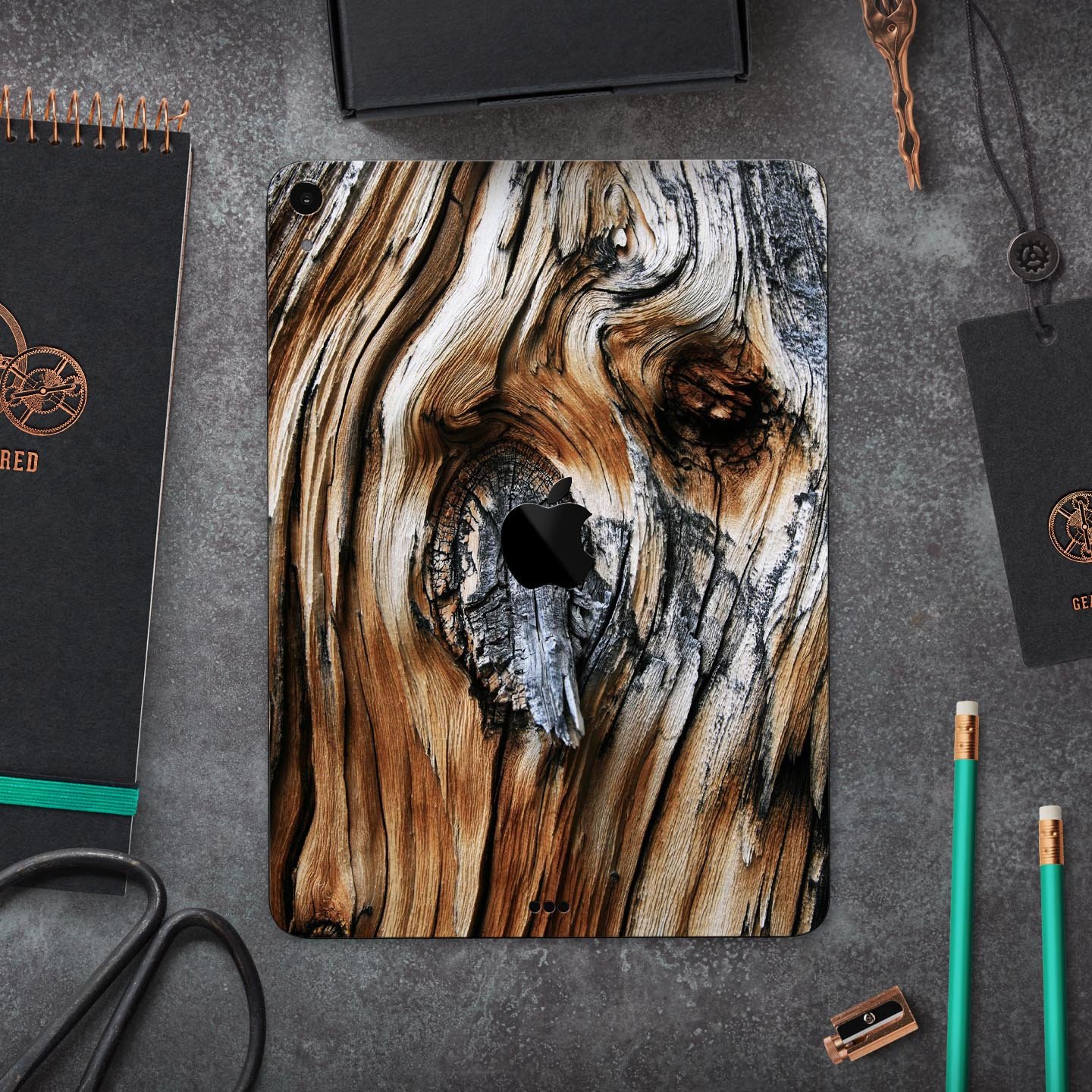 Raw Aged Knobby Wood skin decal for Apple iPad Pro, showcasing its unique wood texture and premium finish.