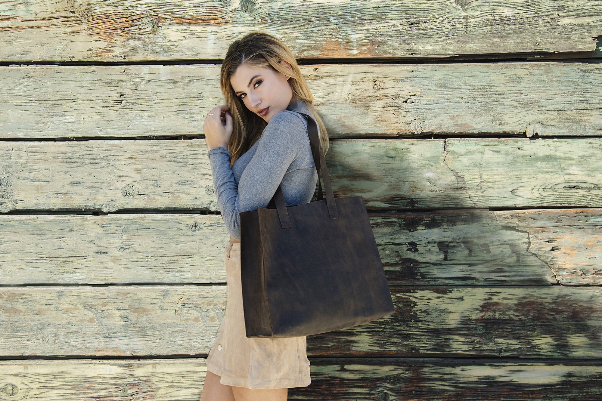 A stylish Raw Edge Tote made from top grain cowhide leather with a marbled mocha finish and unlined interior.