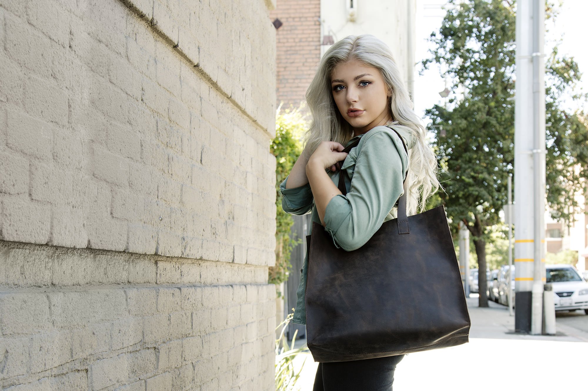 A stylish Raw Edge Tote made from top grain cowhide leather with a marbled mocha finish and unlined interior.