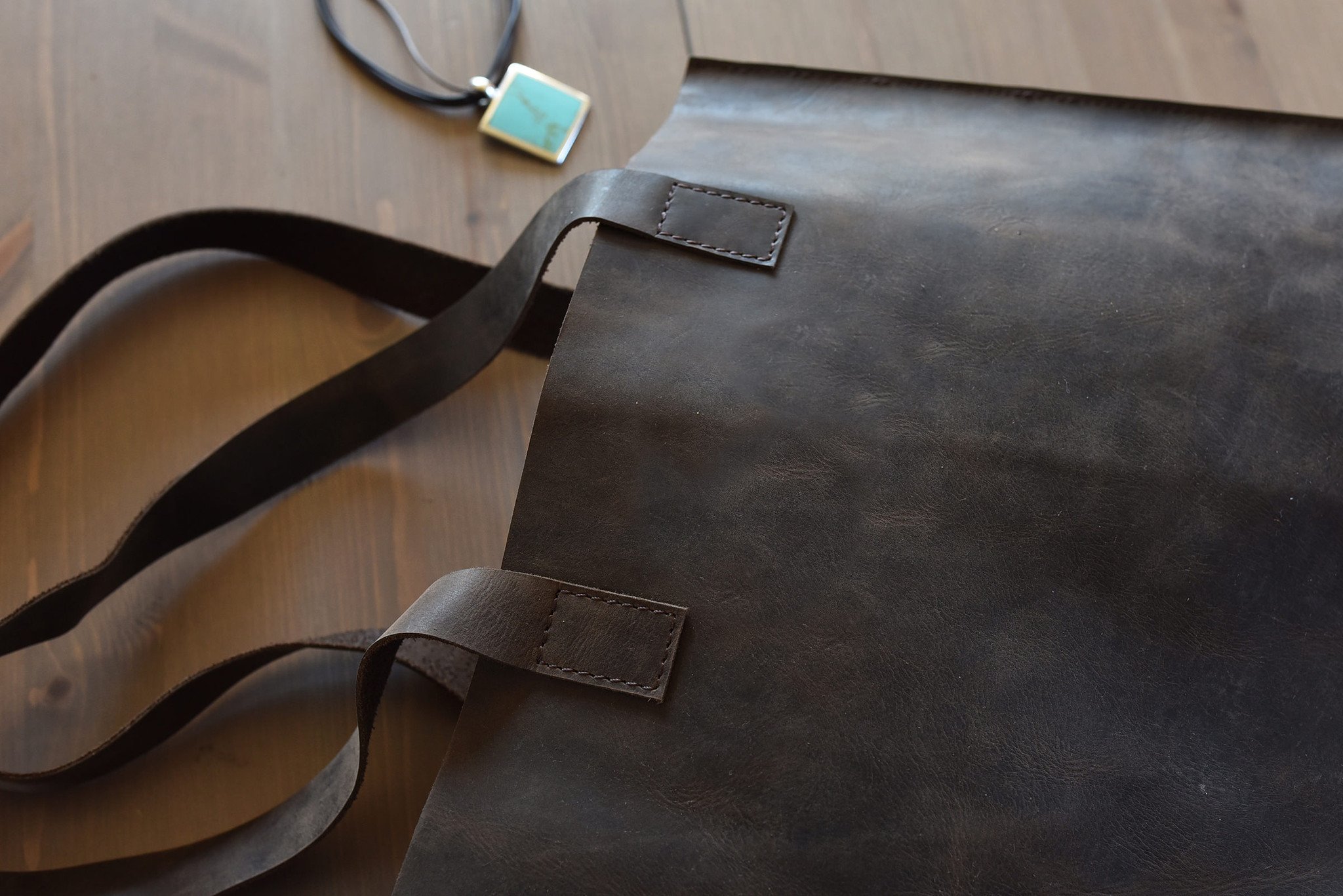 A stylish Raw Edge Tote made from top grain cowhide leather with a marbled mocha finish and unlined interior.