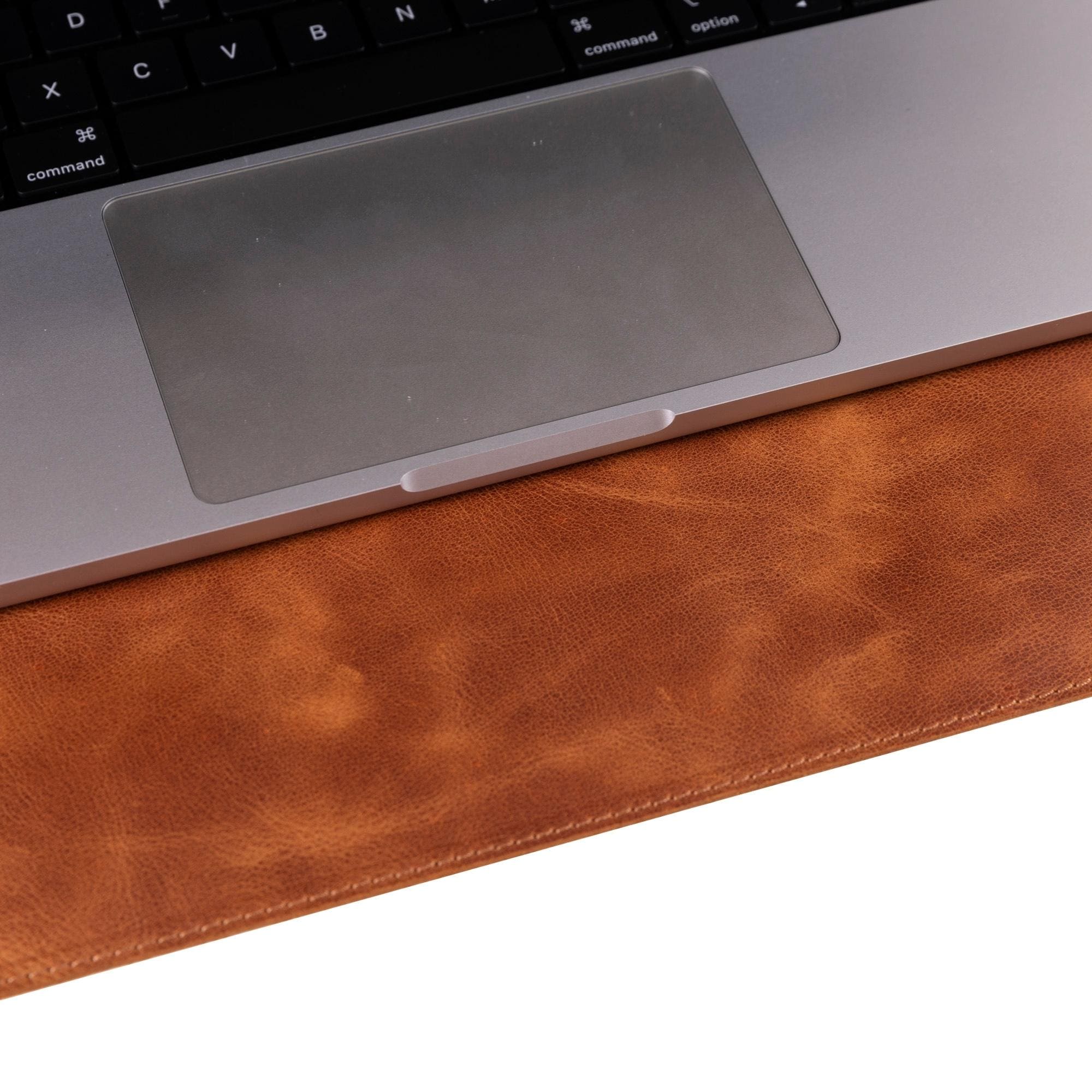 Rawlins Leather Desk Pads in two sizes, showcasing handcrafted full-grain leather with a smooth surface for optimal use.