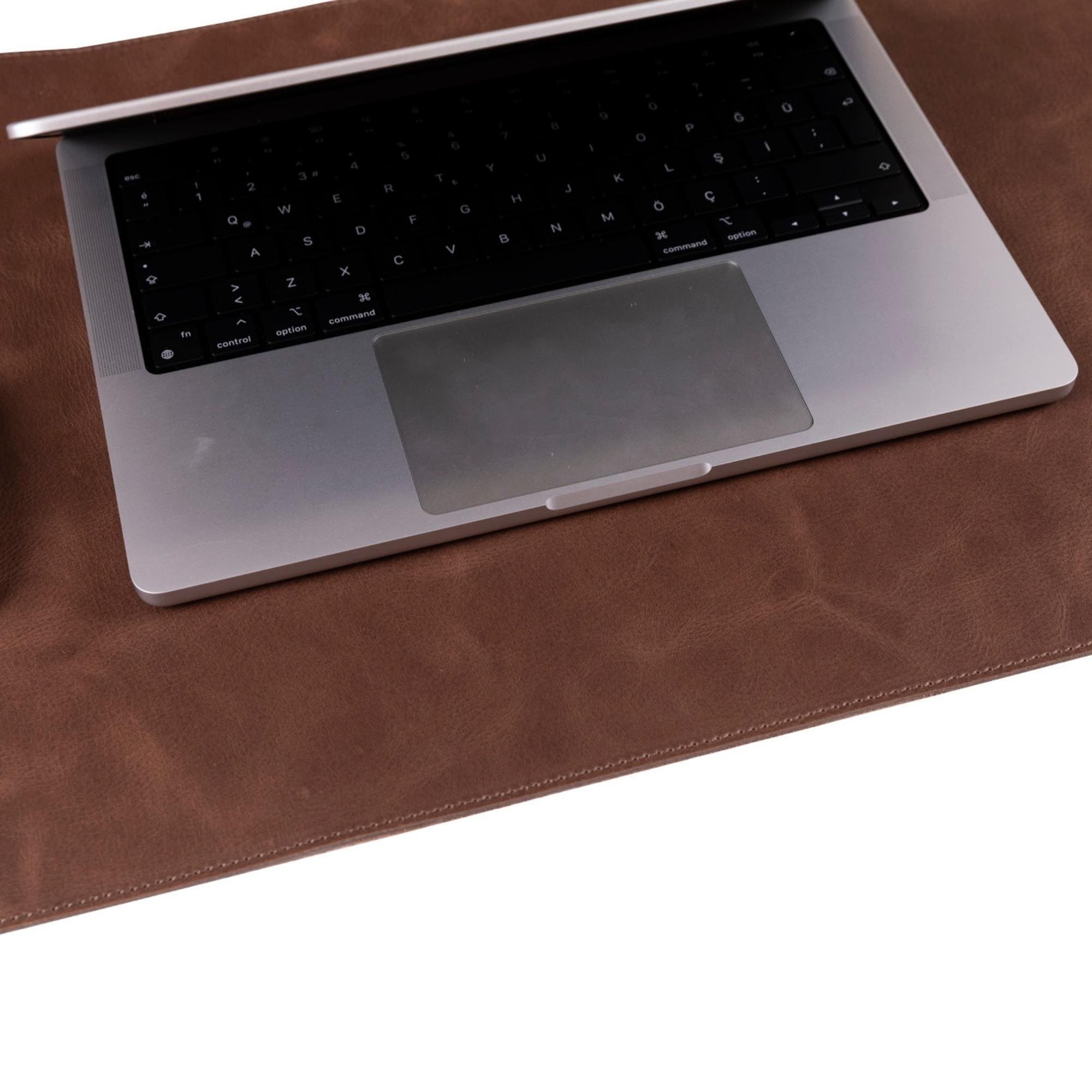 Rawlins Leather Desk Pads in two sizes, showcasing handcrafted full-grain leather with a smooth surface for optimal use.