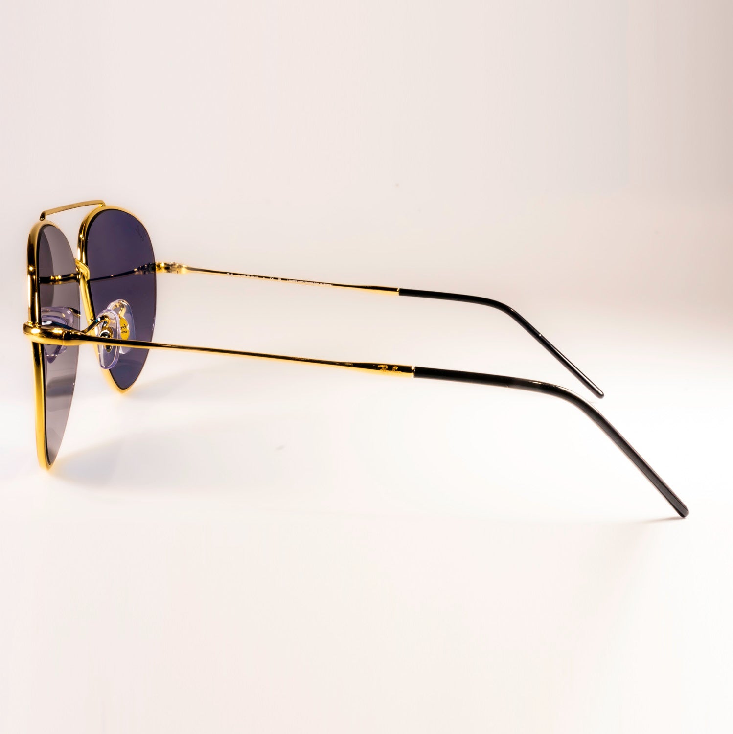 Ray-Ban RBR0101S Aviator Reverse sunglasses featuring a classic pilot shape with a sleek metal frame.