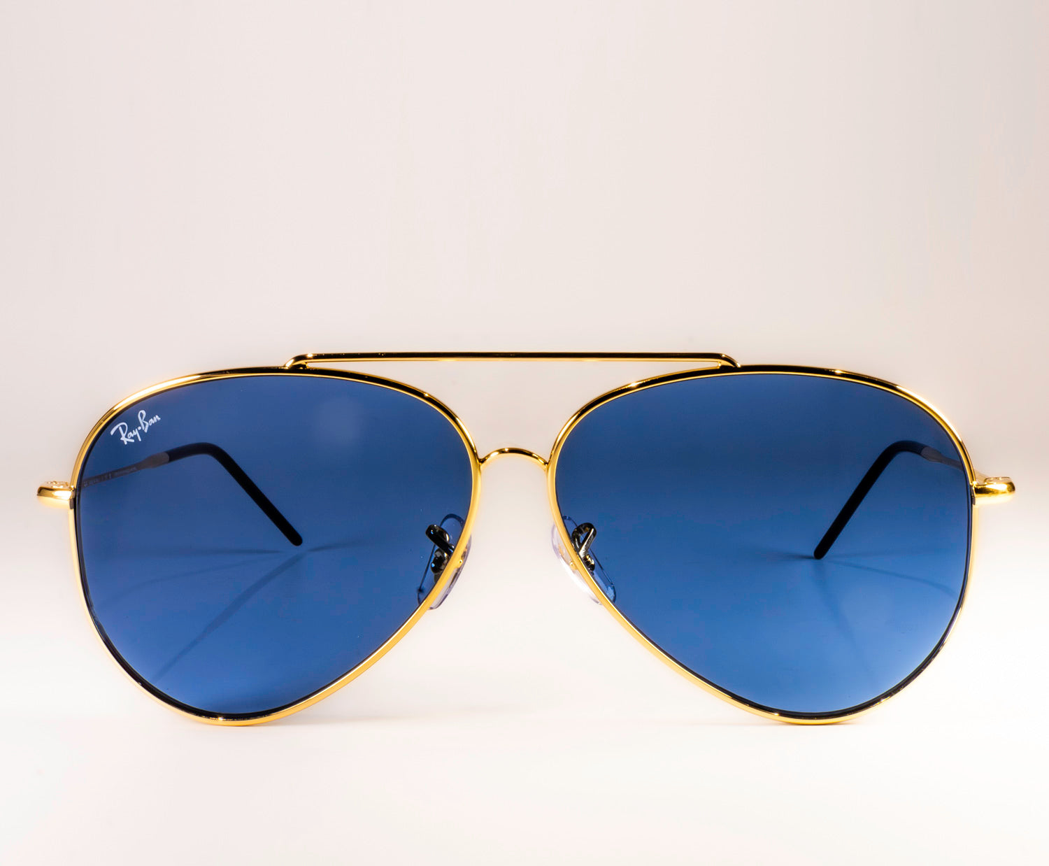 Ray-Ban RBR0101S Aviator Reverse sunglasses featuring a classic pilot shape with a sleek metal frame.