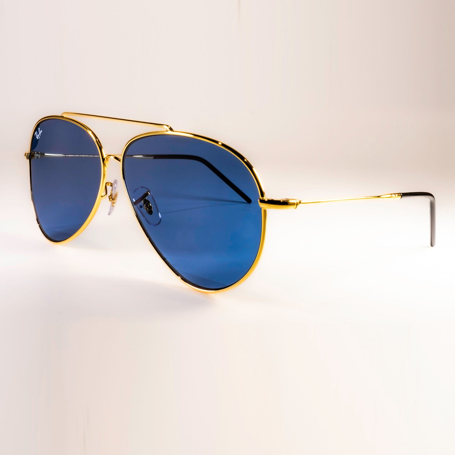 Ray-Ban RBR0101S Aviator Reverse sunglasses featuring a classic pilot shape with a sleek metal frame.