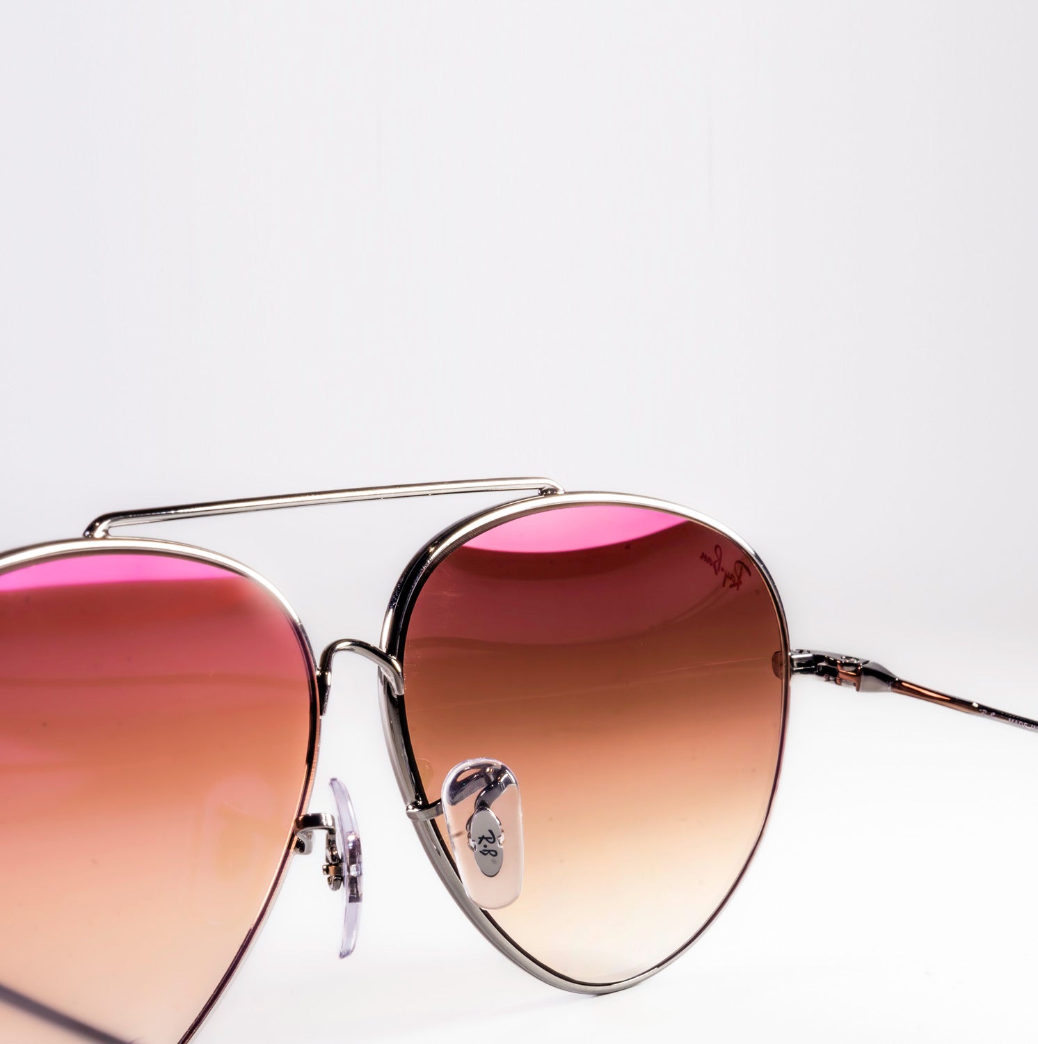 Ray-Ban RBR0101S Aviator Reverse sunglasses featuring a classic pilot shape with a sleek metal frame.