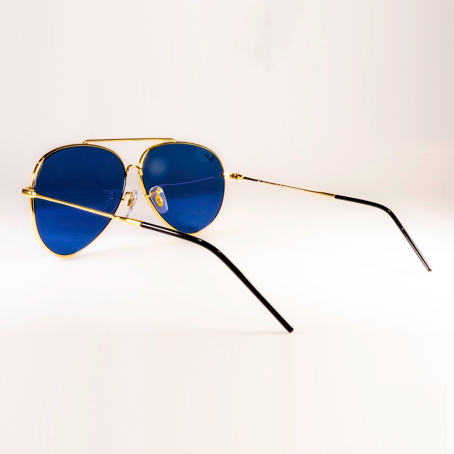 Ray-Ban RBR0101S Aviator Reverse sunglasses featuring a classic pilot shape with a sleek metal frame.