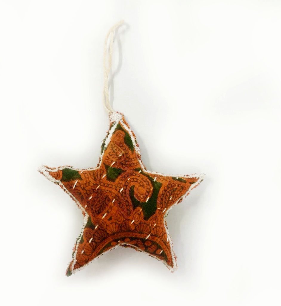 A collection of unique Recycled Fabric Ornaments made from colorful Kantha fabric scraps, featuring various shapes like stars, hearts, and trees.