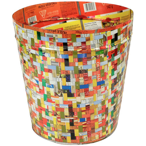 A vibrant, handcrafted wastebasket made from recycled metal, showcasing multicolored strips interlaced together, perfect for home or office use.