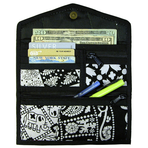 A colorful Recycled Patchwork Clutch made from various recycled fabrics, showcasing its unique design and multiple compartments.