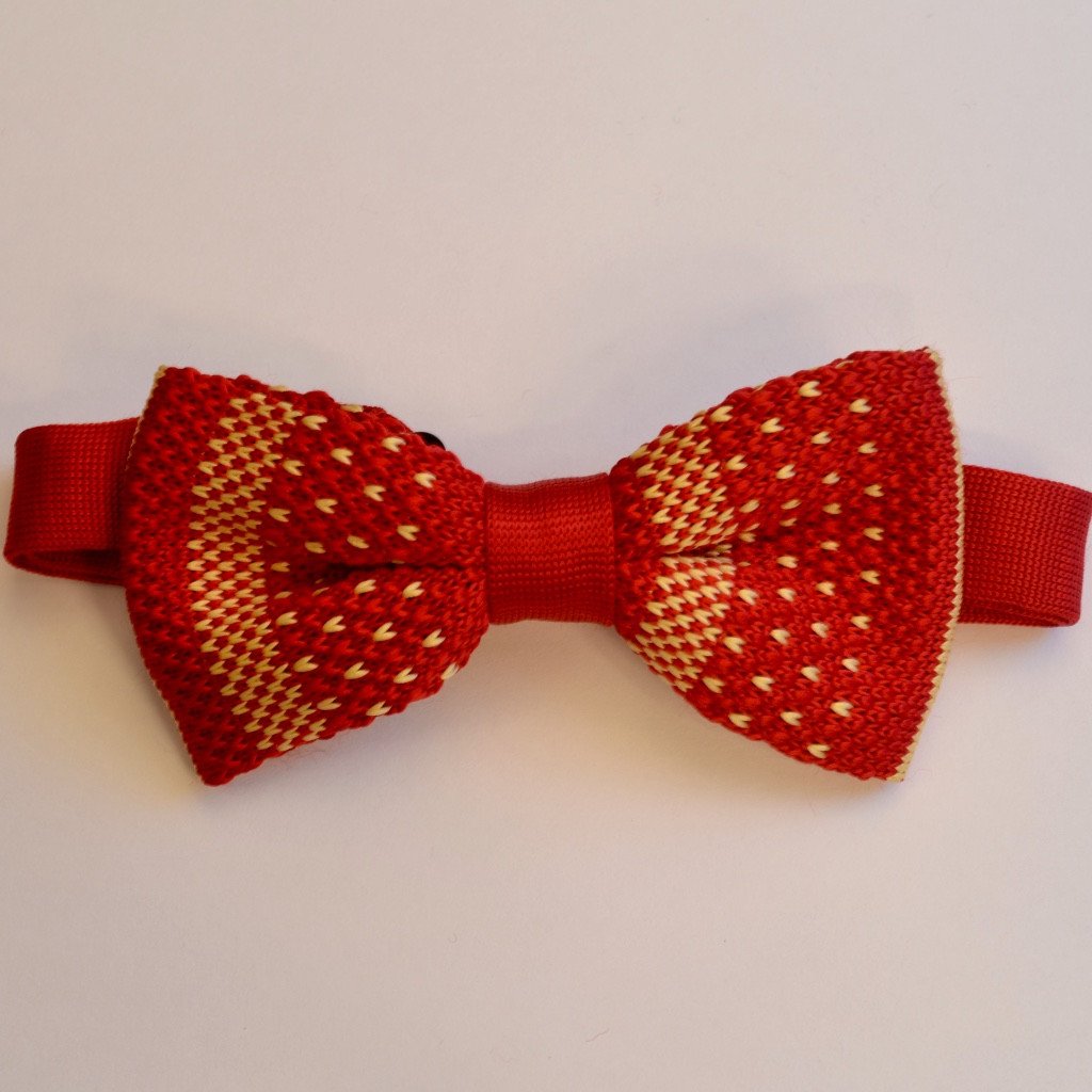 A vibrant red and orange knitted bow tie, elegantly crafted and pre-tied for easy wear.