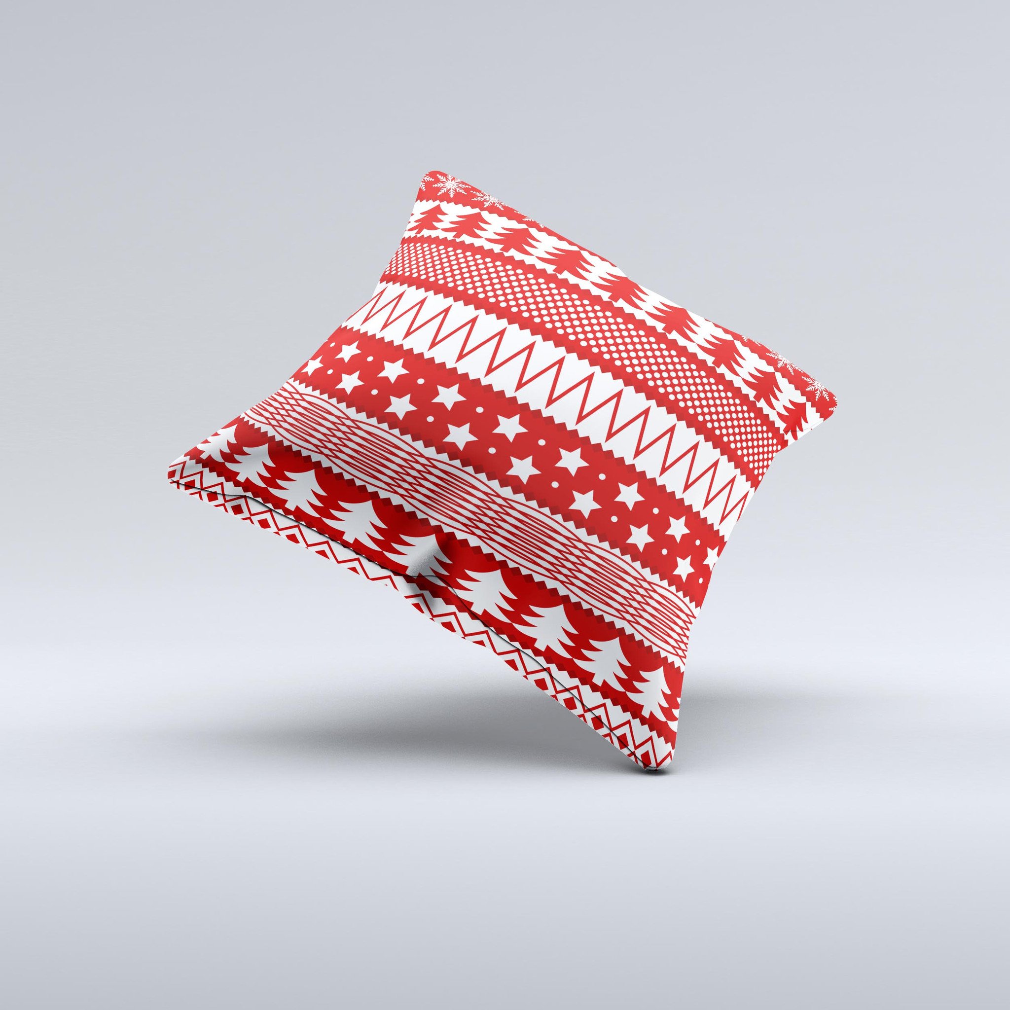 Red and white decorative throw pillow featuring a Christmas pattern, handcrafted in Virginia with high-quality materials.