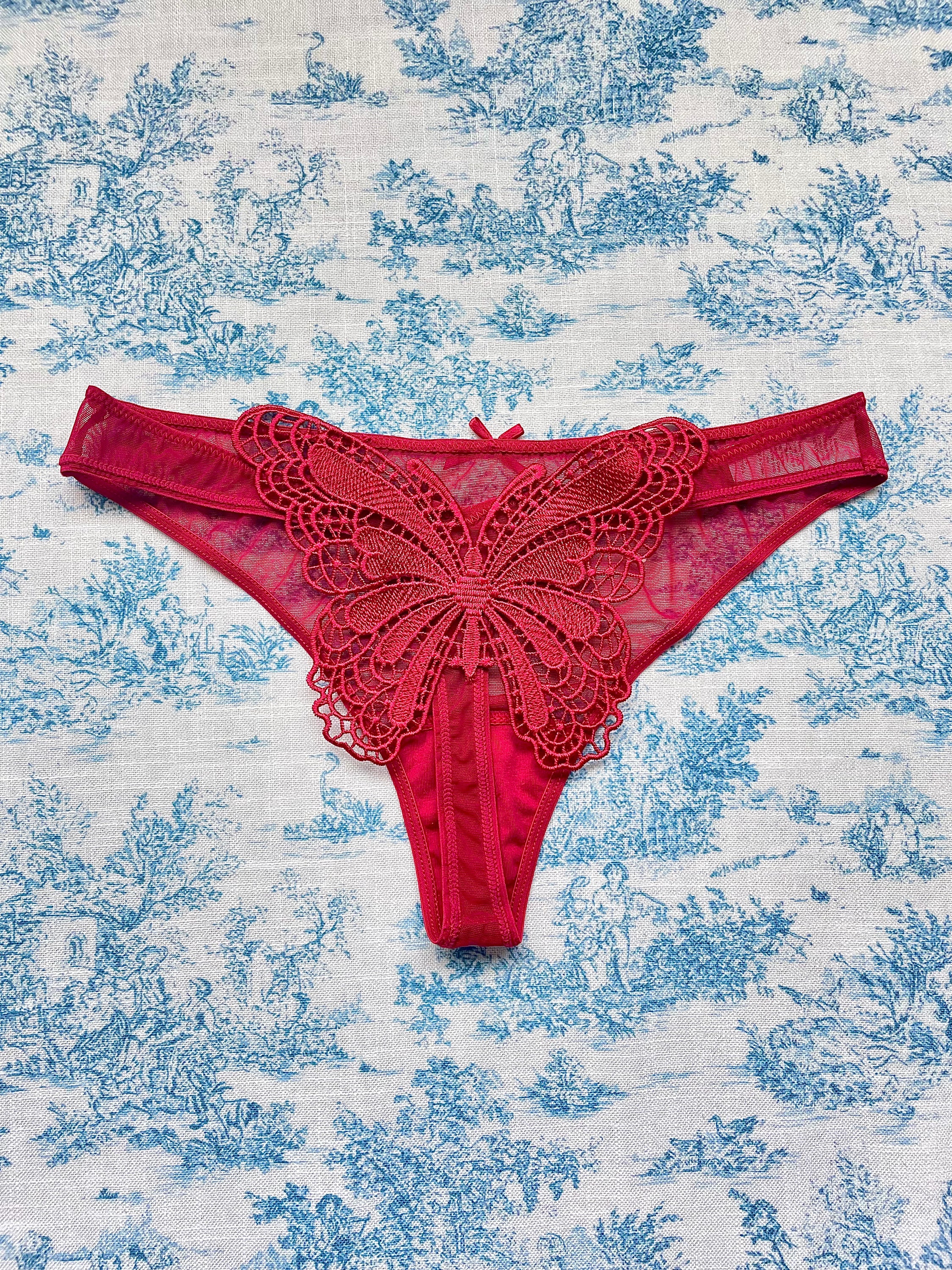 Red mesh butterfly panty featuring a playful butterfly design on the back and comfortable cotton lining.