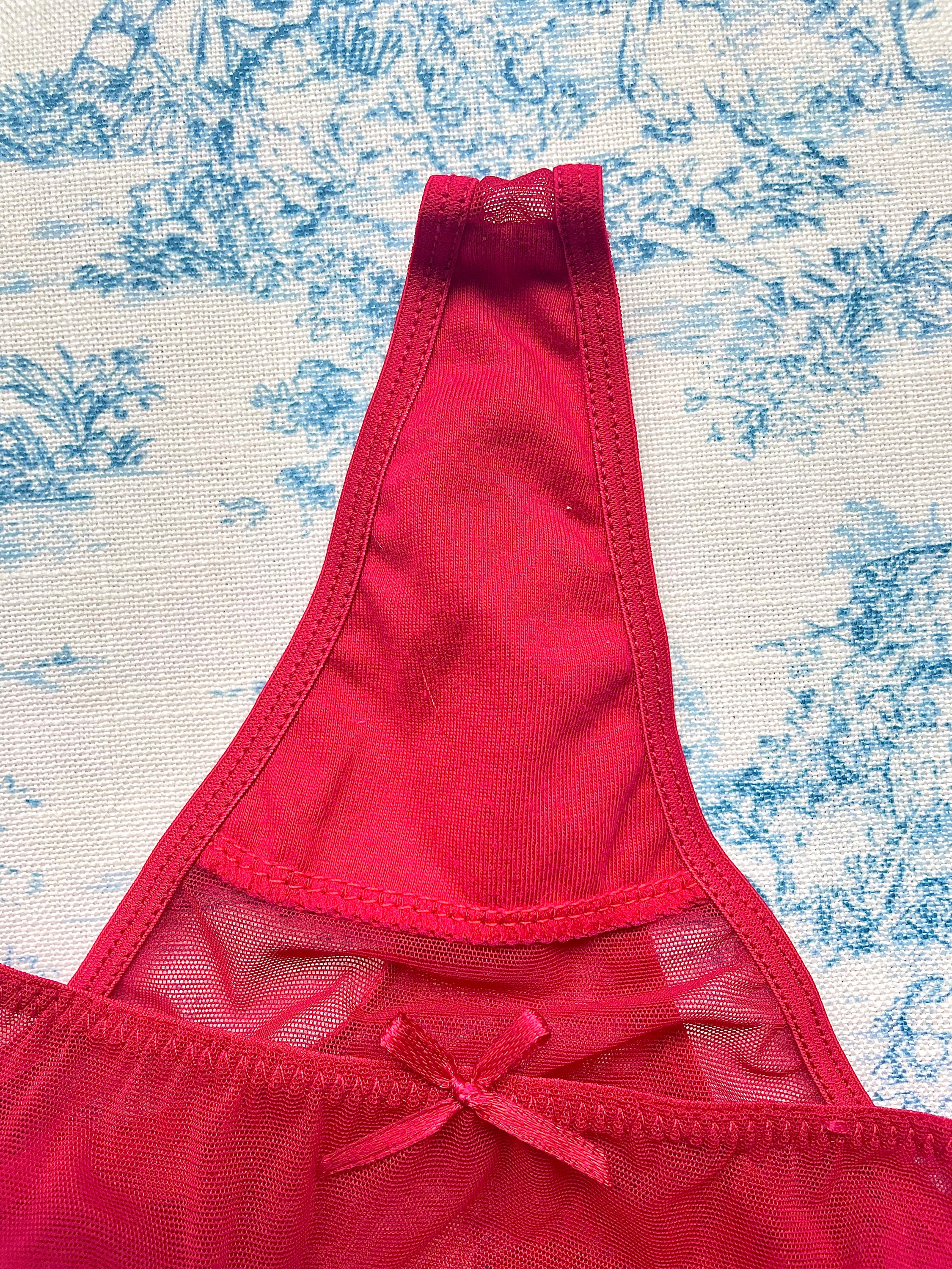 Red mesh butterfly panty featuring a playful butterfly design on the back and comfortable cotton lining.