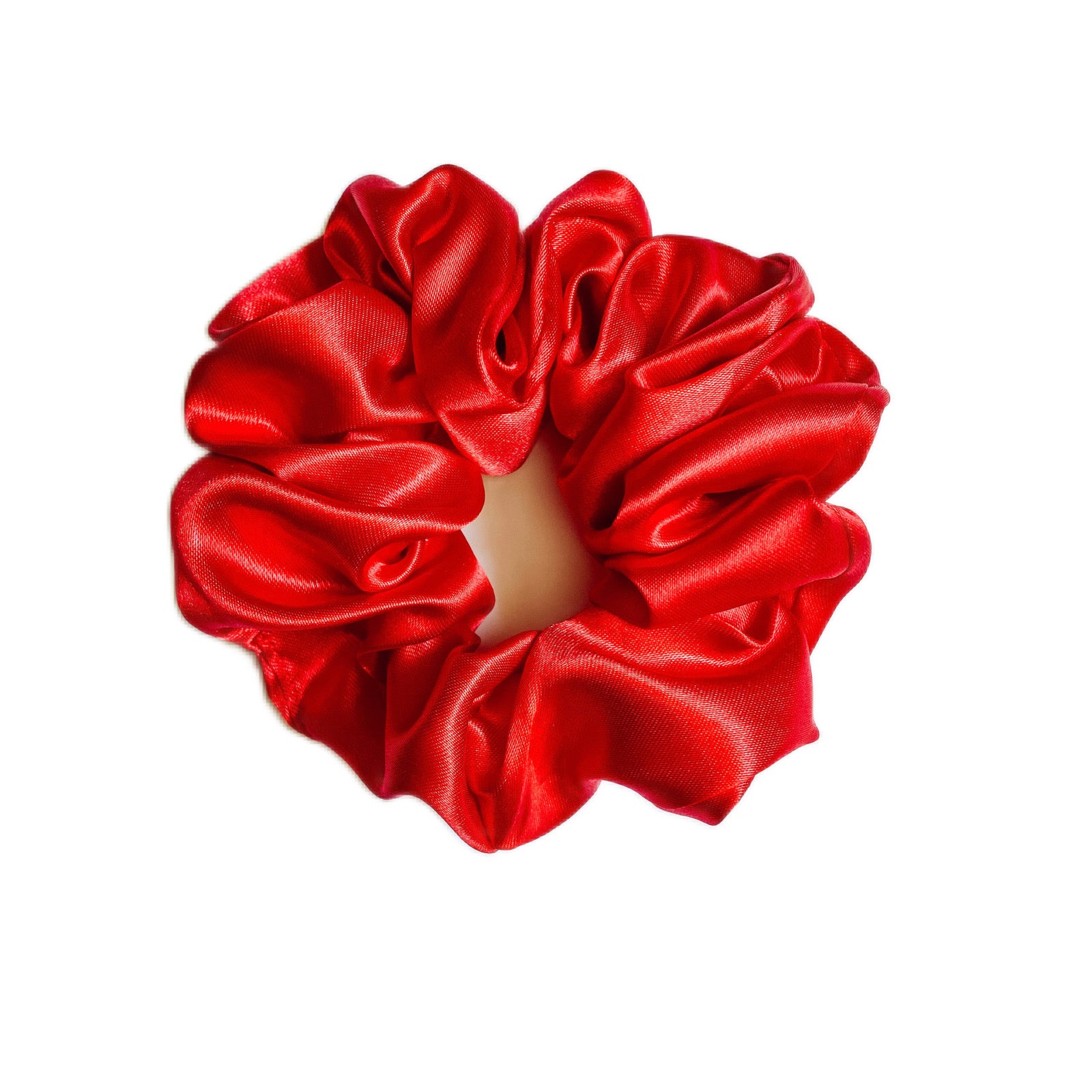 A luxurious red silk satin scrunchie, fluffy and stylish, perfect for all hair types.