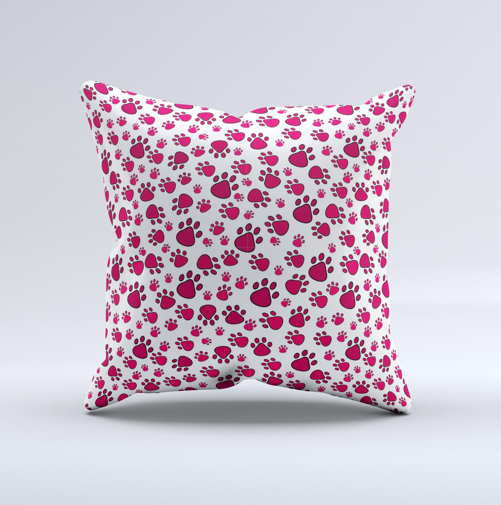 Red and white decorative throw pillow featuring paw prints, handcrafted in Virginia with high-quality fabric and filling.