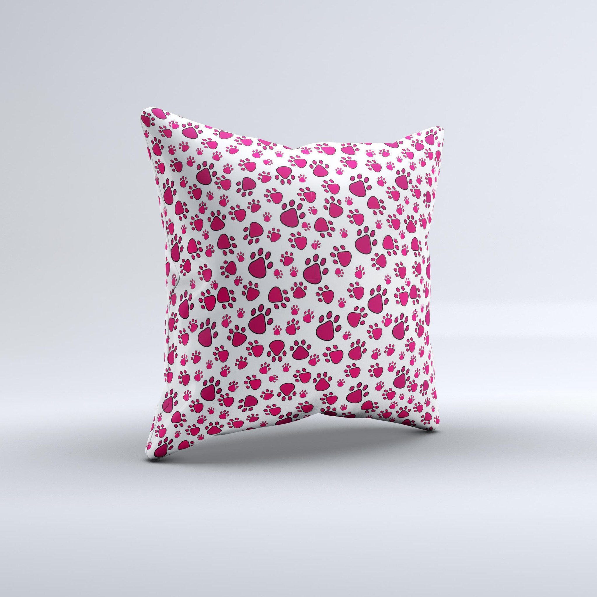 Red and white decorative throw pillow featuring paw prints, handcrafted in Virginia with high-quality fabric and filling.