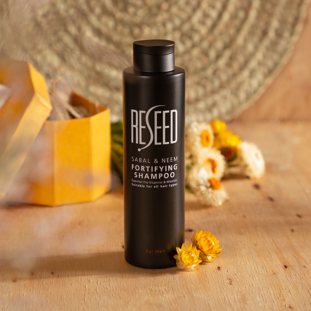 RESEED Sabal and Neem Fortifying Shampoo for Men in a 250ml bottle, showcasing its natural ingredients and sleek design.