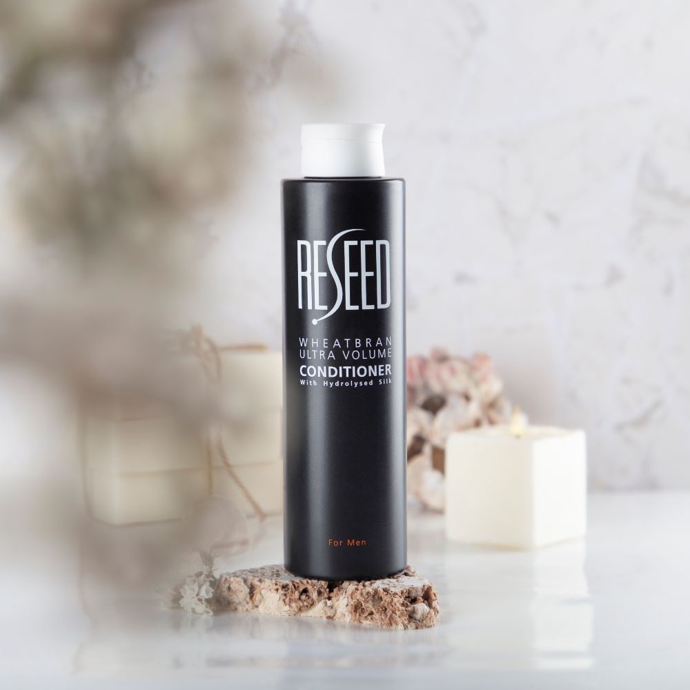 RESEED Wheat Bran Ultra Volume Conditioner for Men 250ml bottle with sleek design and natural ingredients.