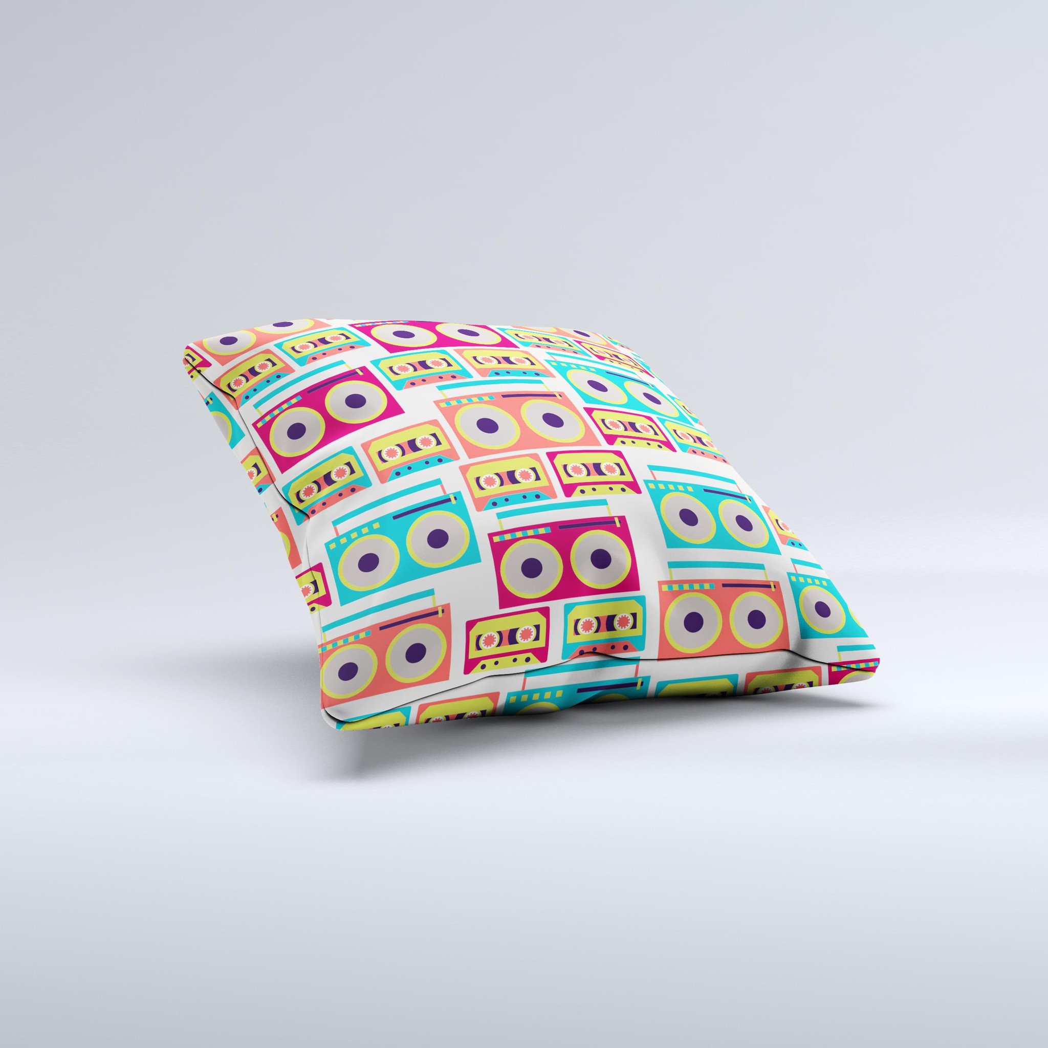 A decorative throw pillow featuring a vibrant retro boombox pattern, handcrafted in Virginia with high-quality fabric and polyester filling.