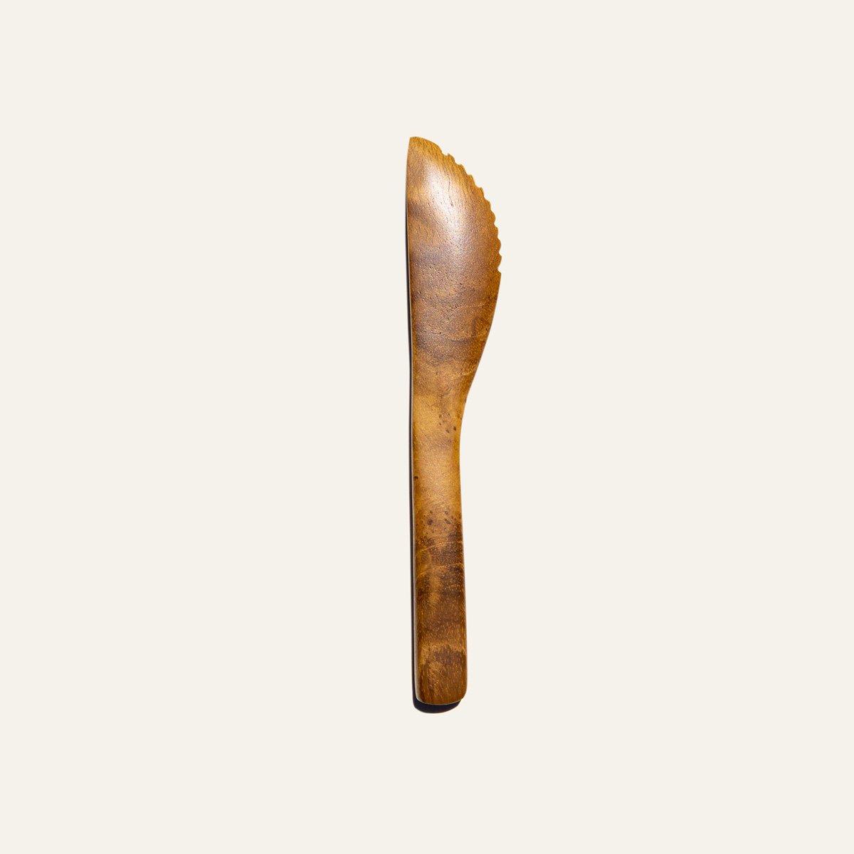 Handmade Duebest™ reusable teak wood knife, showcasing unique grain and color, perfect for sustainable dining.