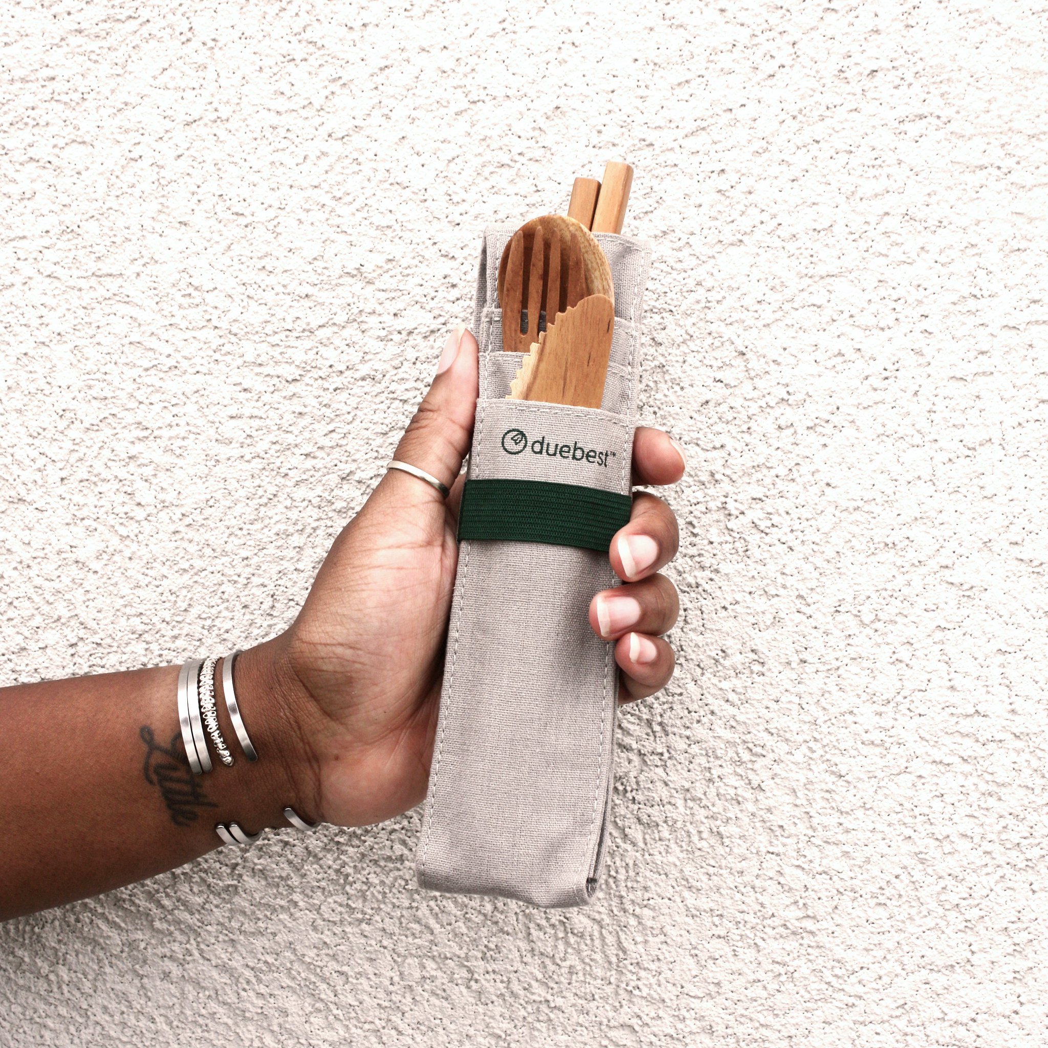 A beautifully crafted Reusable Wooden Cutlery Set including a spoon, fork, knife, chopsticks, and a glass straw, all in a stylish fabric case.