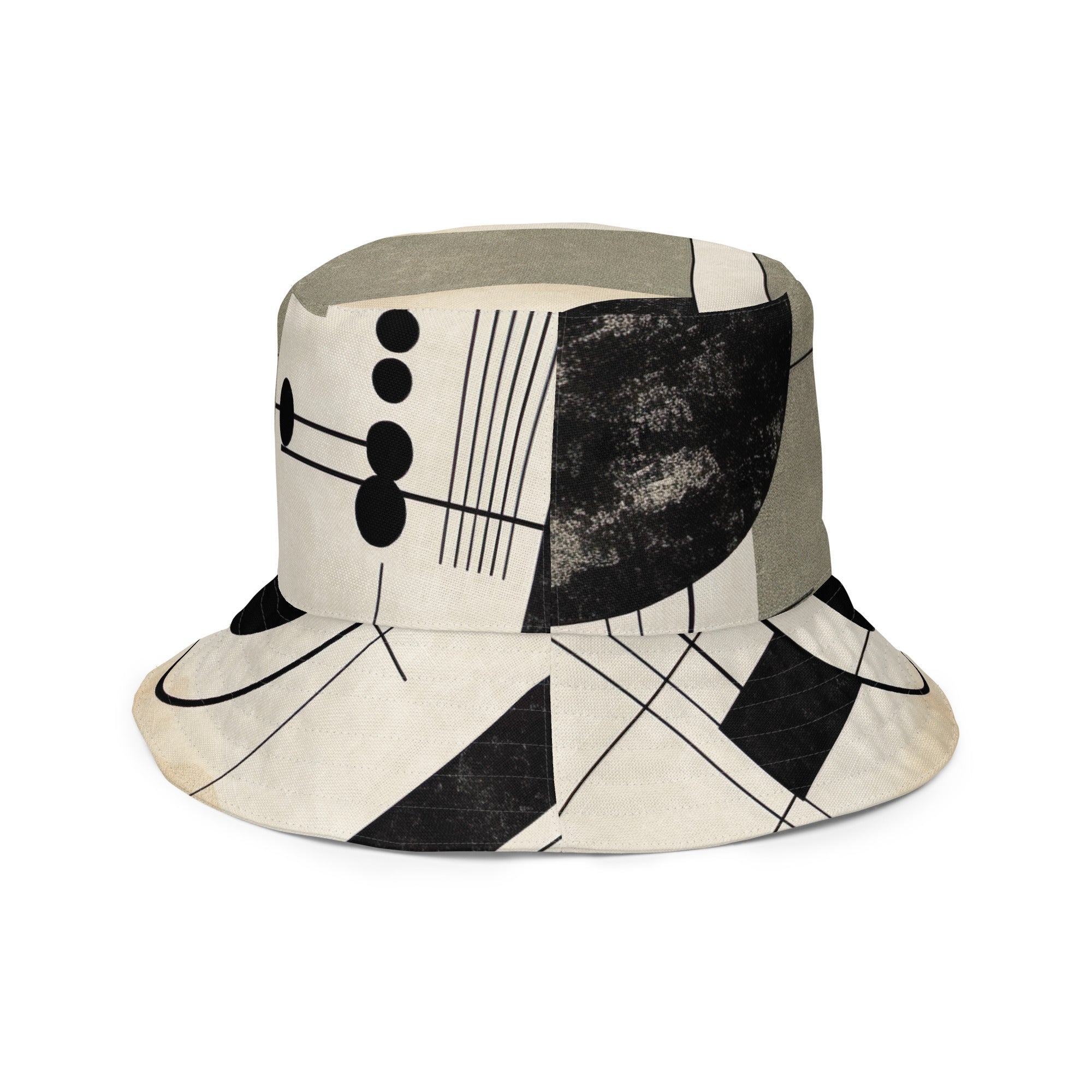 Reversible bucket hat featuring abstract geometric shapes in black, beige, and brown, showcasing both sides of the design.