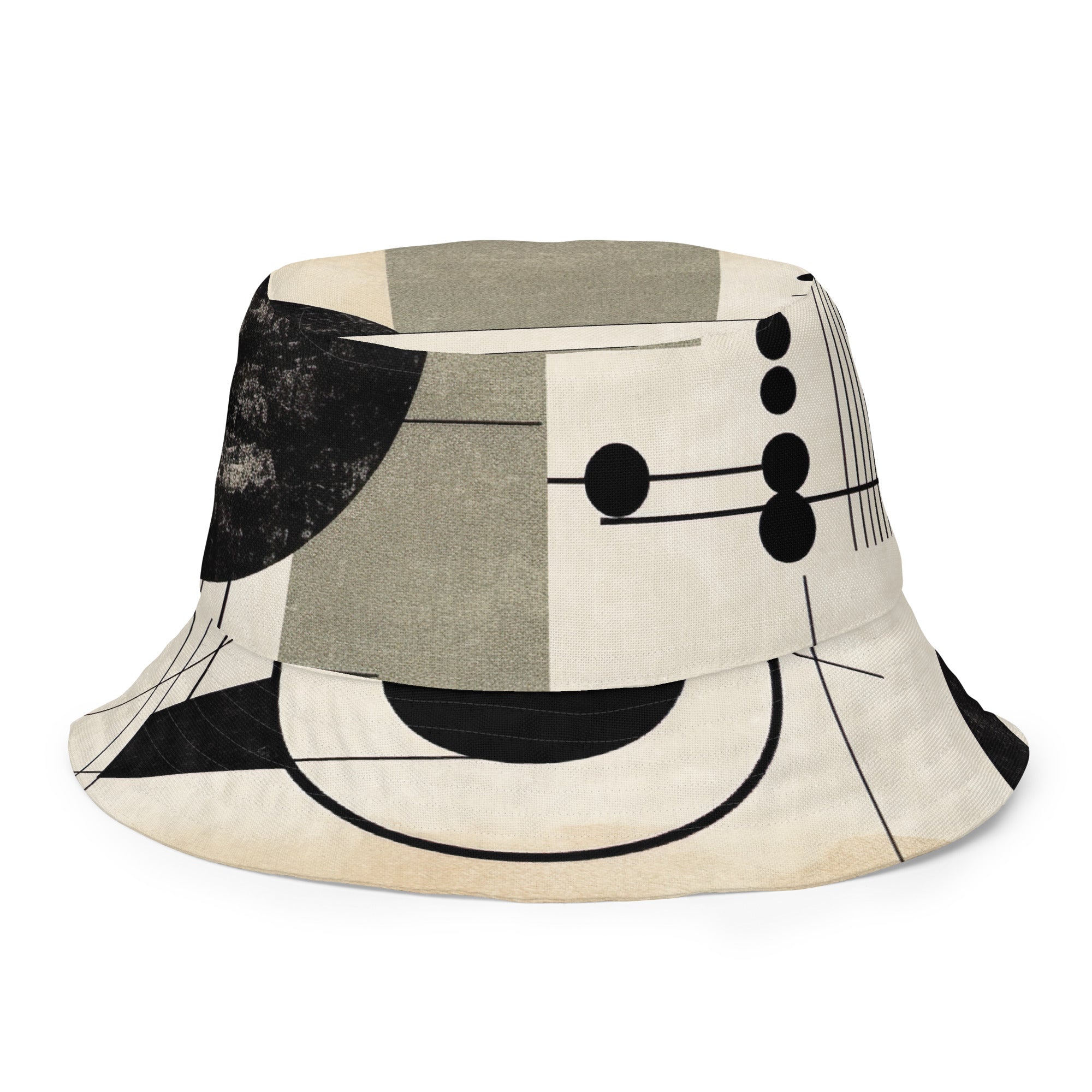 Reversible bucket hat featuring abstract geometric shapes in black, beige, and brown, showcasing both sides of the design.